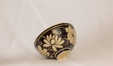 Bowl features an exquisite floral design in a contrasting black and beige color scheme