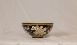 Bowl features an exquisite floral design in a contrasting black and beige color scheme