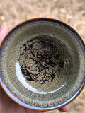 Ceramic cup with dragon design